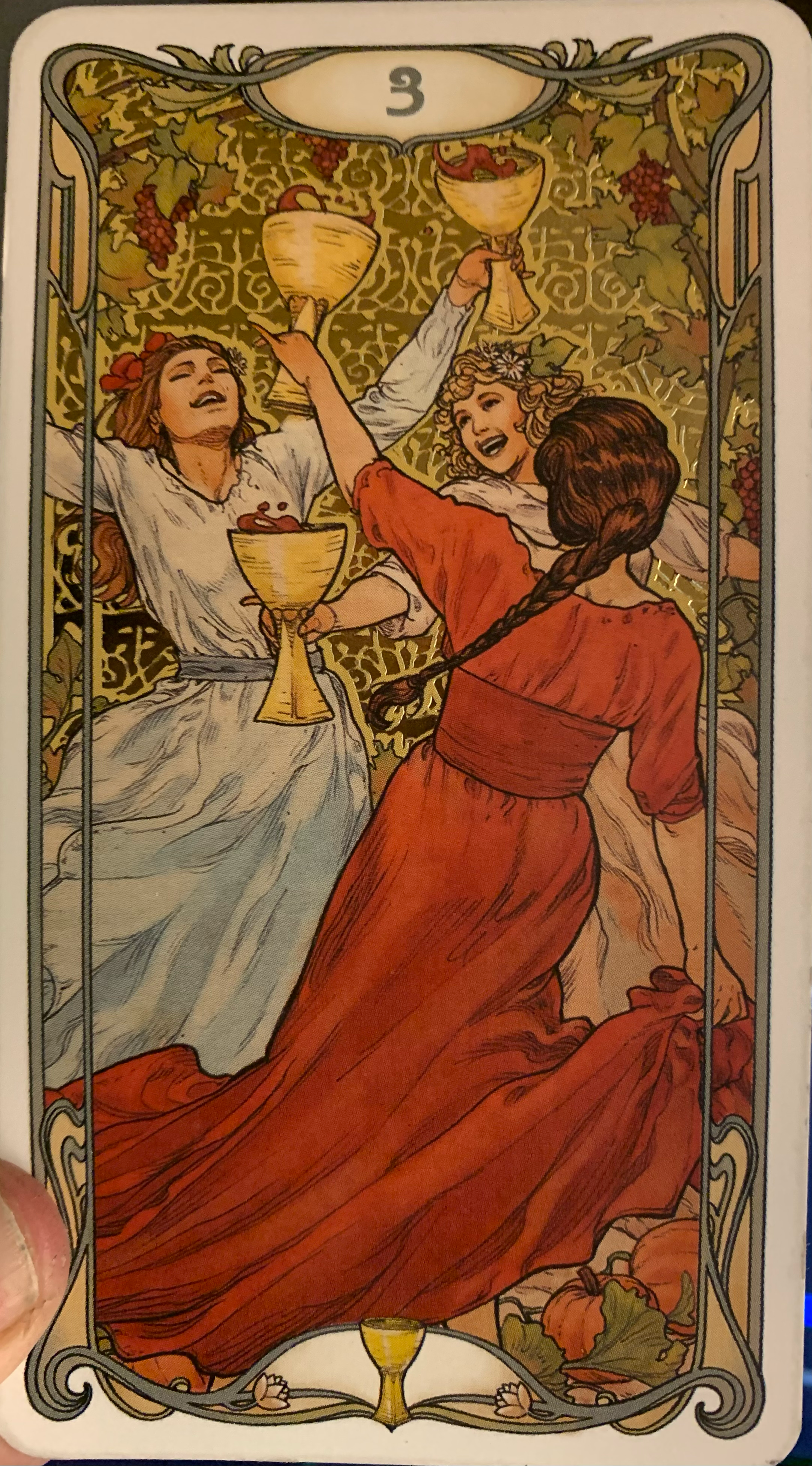 The Three of Cups from the Golden Art Nouveau Tarot deck.